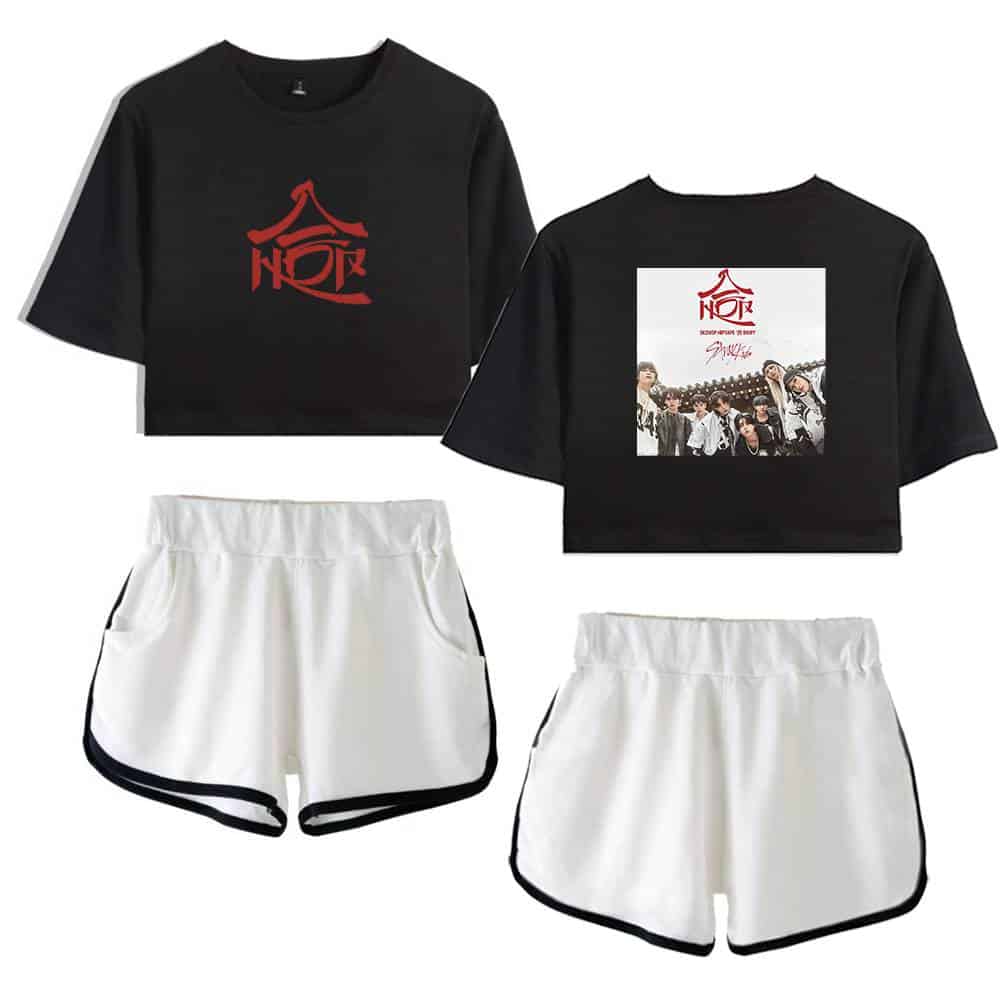 Kpop merch black and white crop top and shorts with group photo print and bold graphic design.