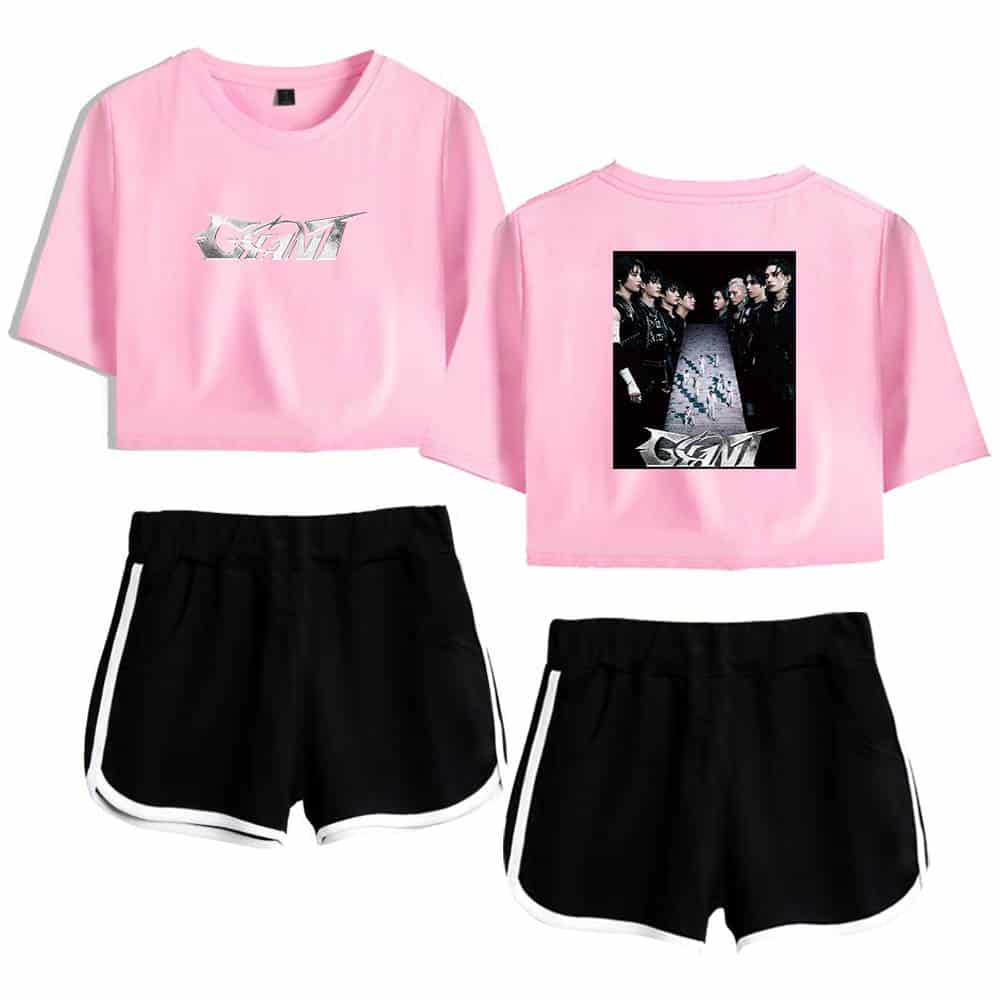 CMK pink cropped T-shirt with graphic print and black shorts with white trim, stylish Kpop merch.