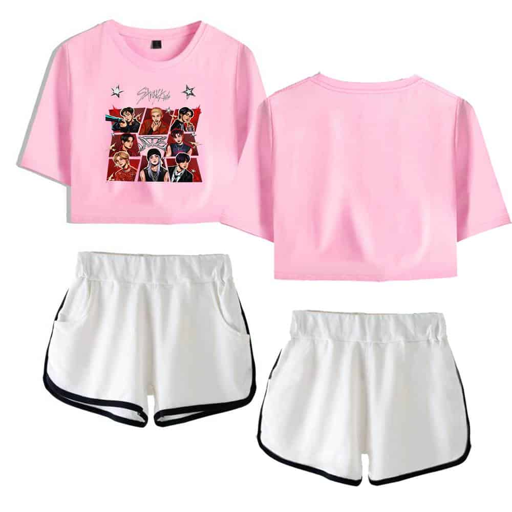 Pink K-pop group merchandise crop top with graphic print and white athletic shorts with black trim.