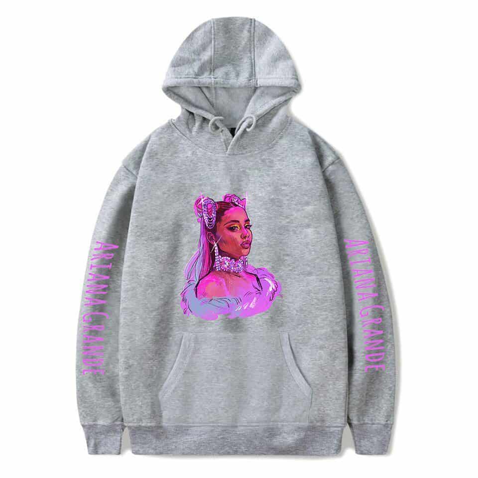 Art pop hoodie featuring a colorful illustrated portrait of Ariana Grande with her name on sleeves, perfect for K-pop merchandise fans.
