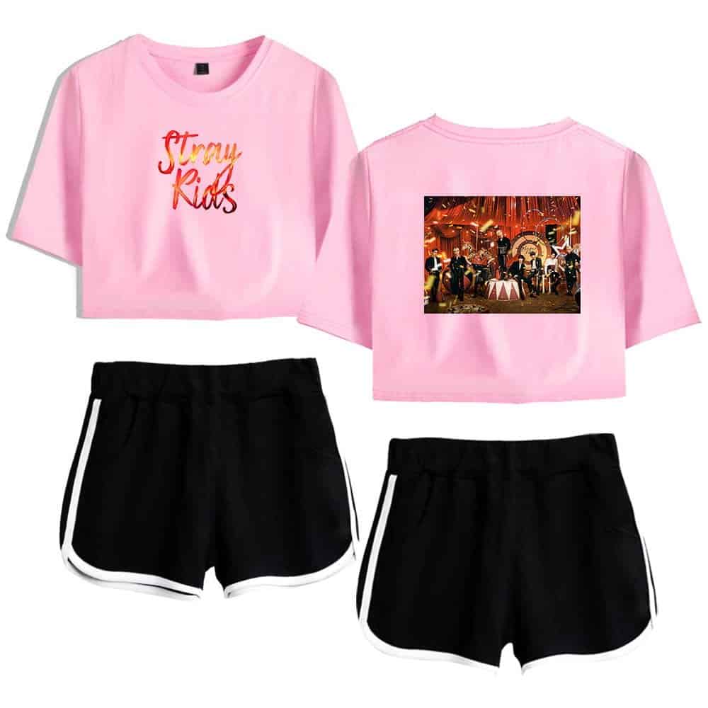 K-pop merch pink graphic t-shirt and black shorts set.