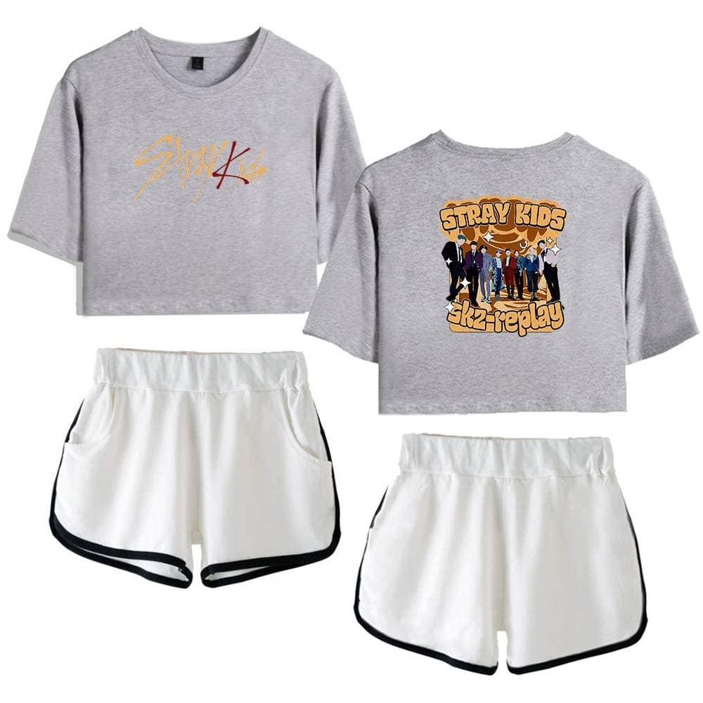 Kpop merch, stylish gray crop tops featuring K-pop band graphics and white shorts with black trim, perfect for fans.