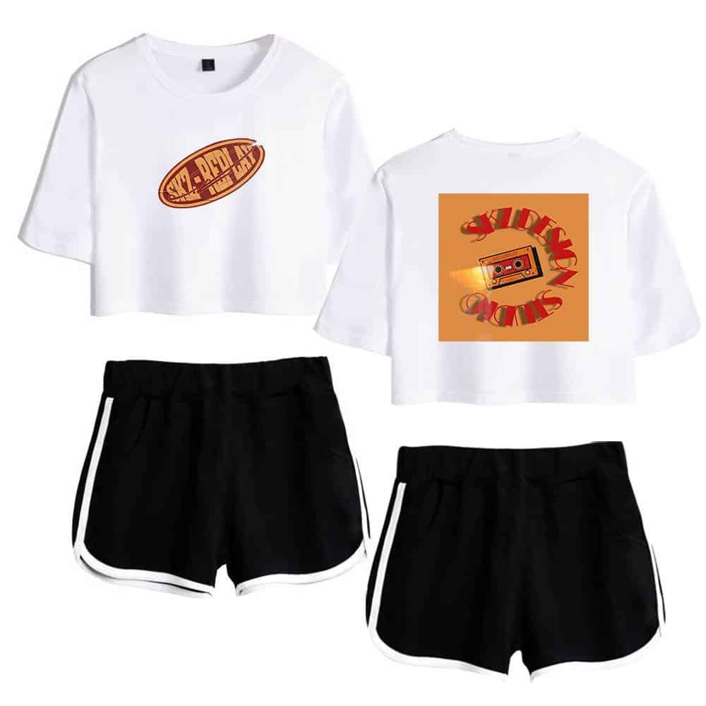 Vibrant Kpop merch set featuring graphic crop tops with retro designs and comfortable black athletic shorts with white side stripes. Perfect for fans and casual wear.