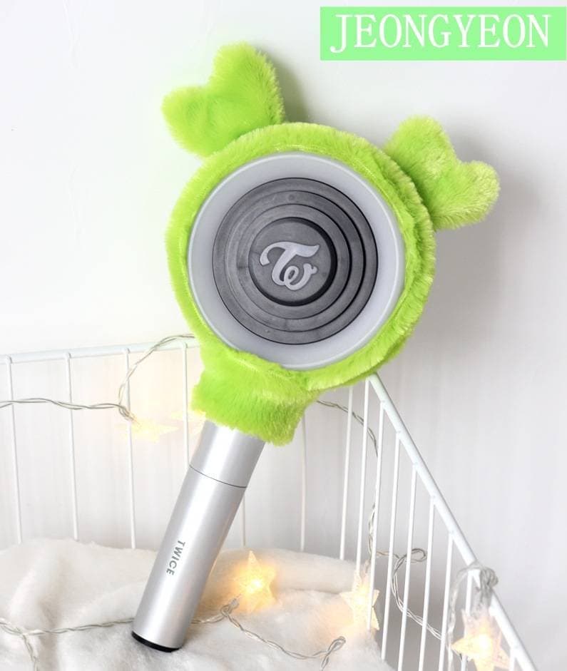 Cute green fuzzy Twice lightstick plush cover with Te logo, Kpop merch accessory for fans.