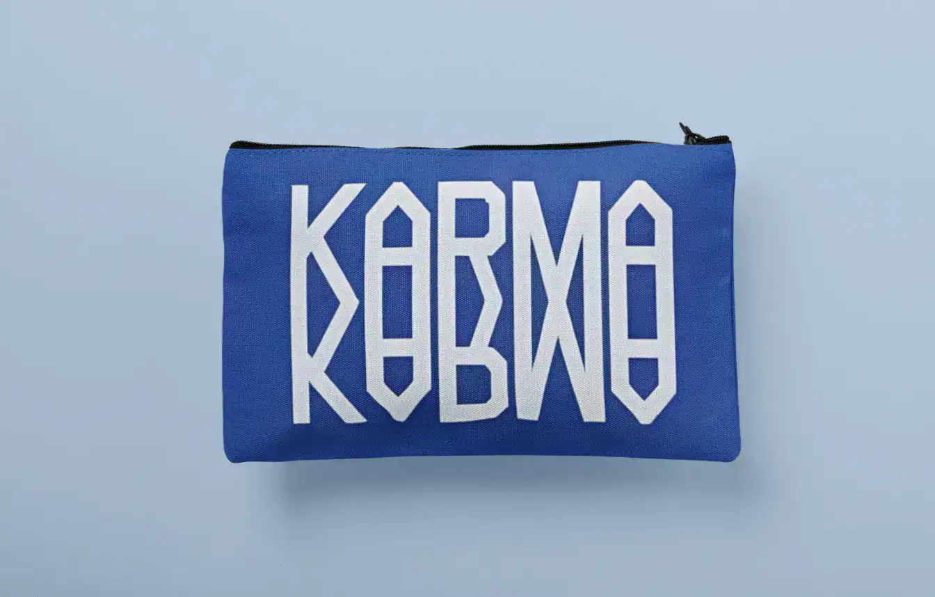 Kpop merchandise pouch featuring bold KARMABOX text on blue fabric.
