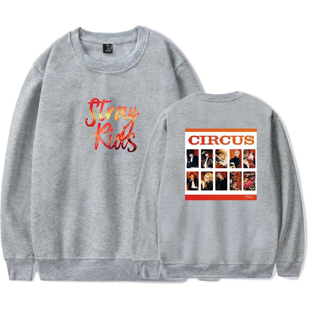 Bright grey sweatshirt featuring "Stray Kids" graphic design and a vibrant collage of group photos on the back, perfect for K-pop merchandise fans.
